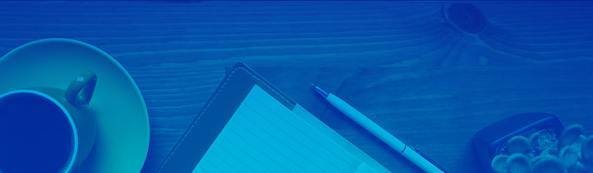 Aerial view of desktop - Pictured left to right: coffee cup, notebook, succulent; with blue overlay over entire image.